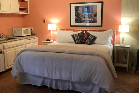 The Napa Inn - room with white bed, lamps, and picture on the wall