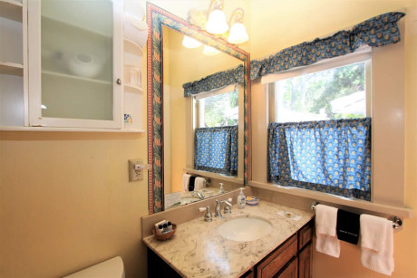 The Napa Inn - bathroom with sink and windows