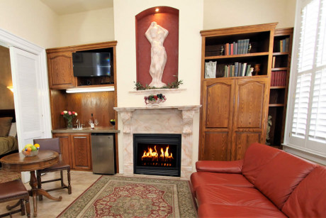 living room with fireplace and table with chairs