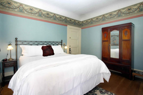 The Napa Inn - bed and large dressing cabinet