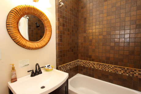 The Napa Inn - bathrrom with sink, mirror and bathtub